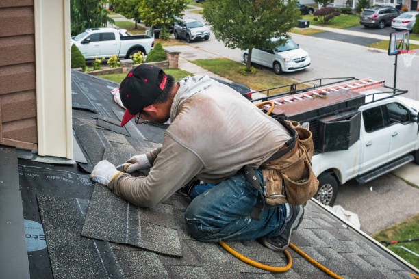 Professional Roofing technician working in Garland, UT